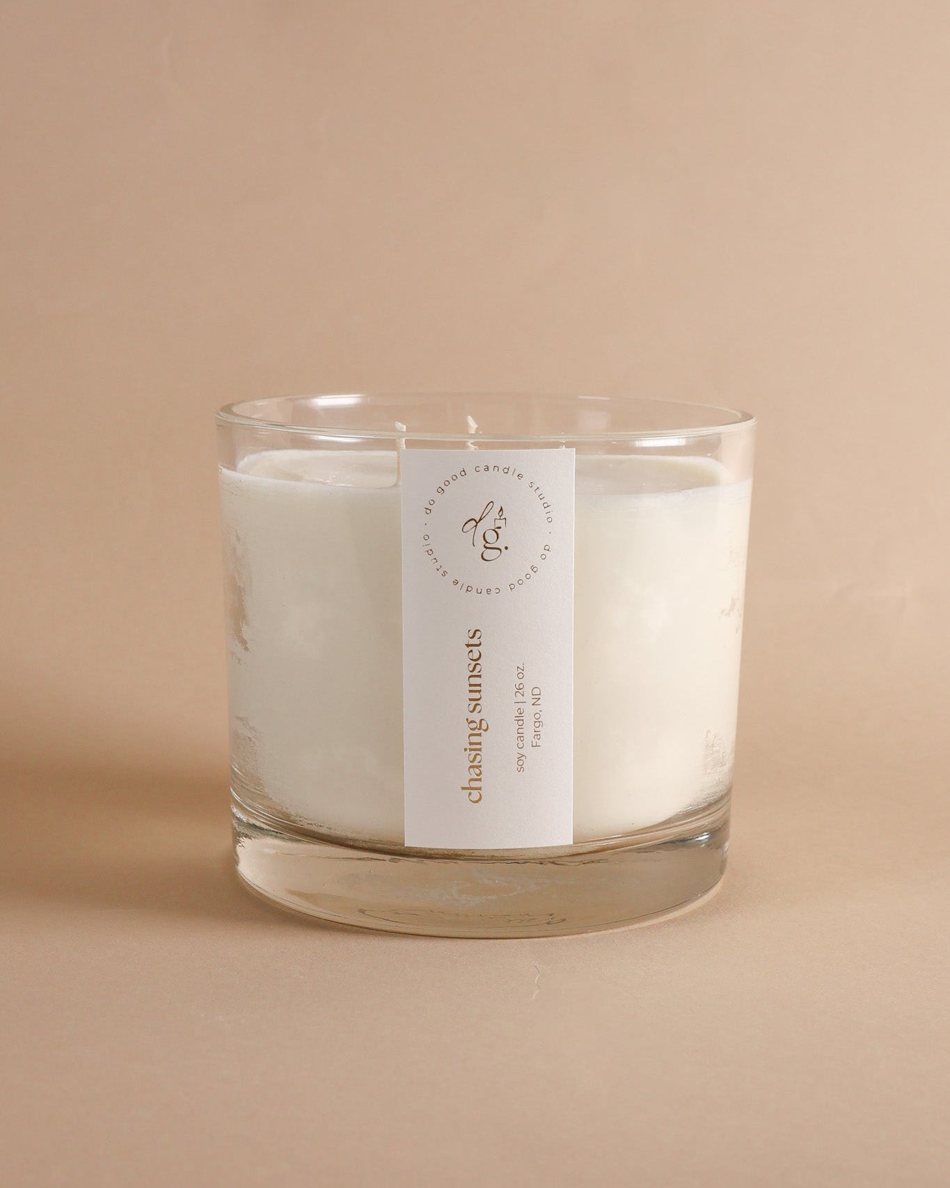Chasing Sunsets  Triple-Wick candle on beige backdrop