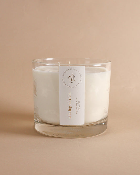 Chasing Sunsets  Triple-Wick candle on beige backdrop