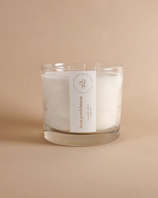 Front Porch Breeze Triple-Wick candle on beige background