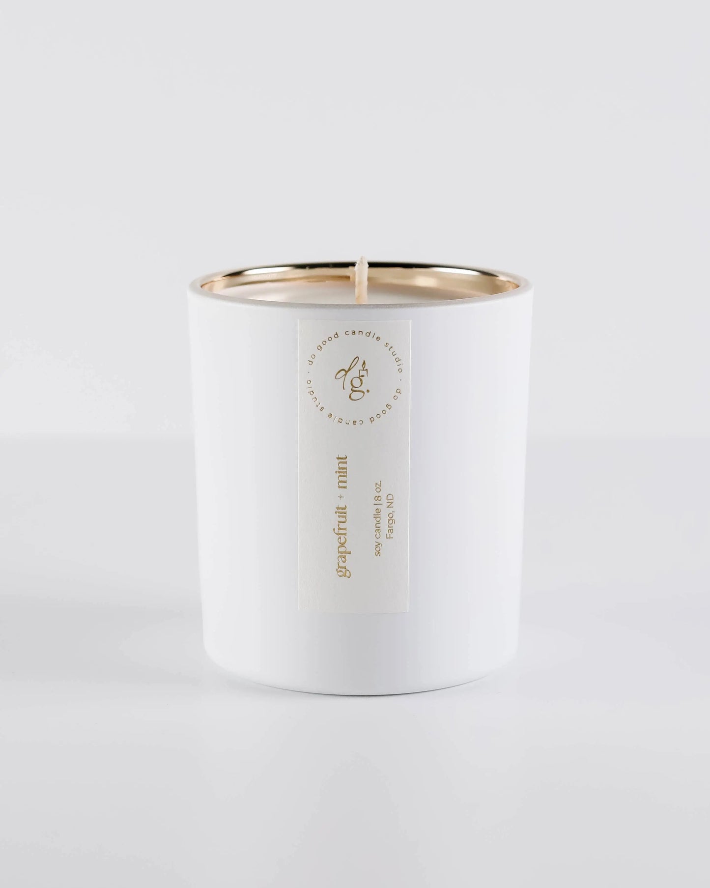 Grapefruit + Mint candle on a white backdrop
