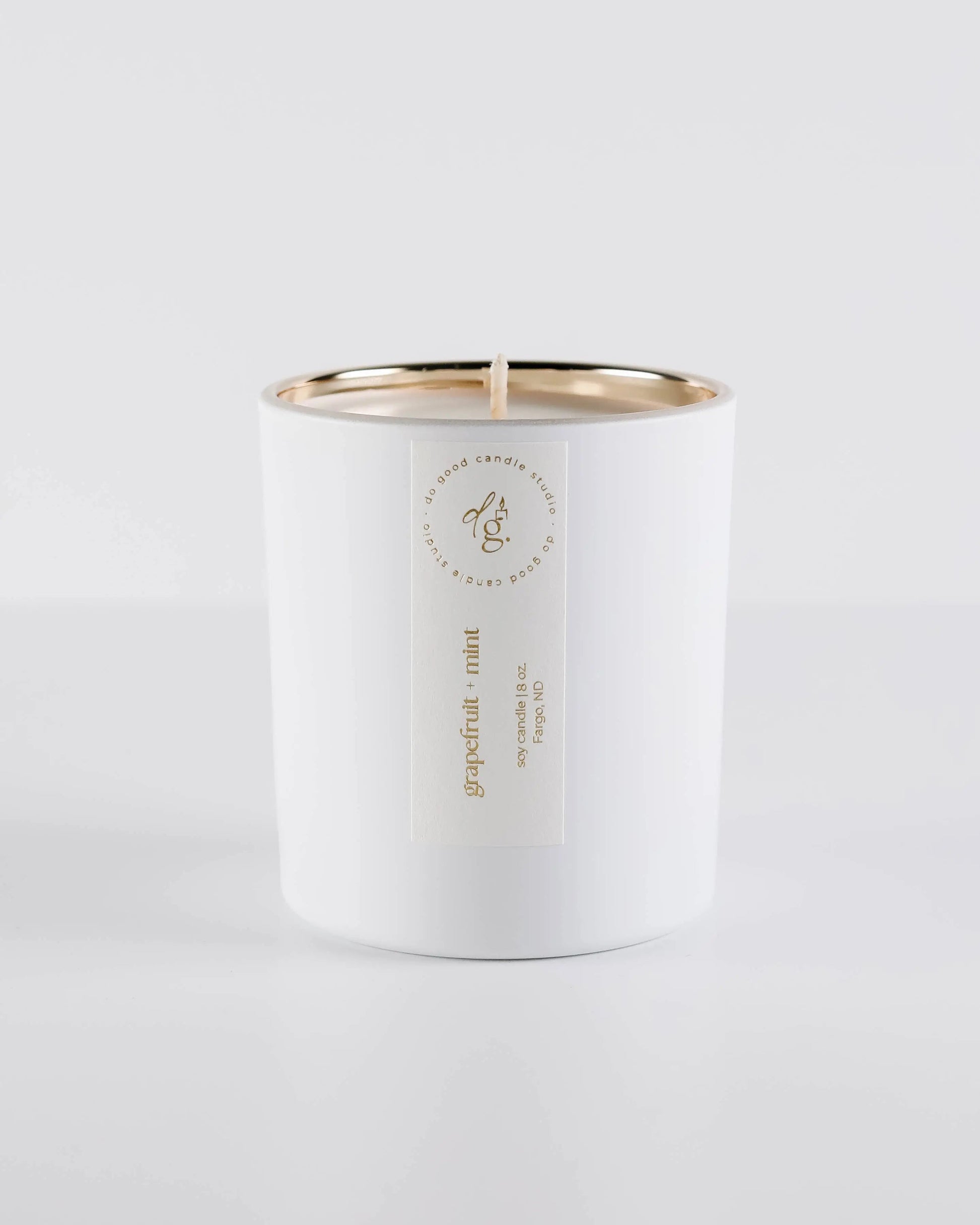 Grapefruit + Mint candle on a white backdrop