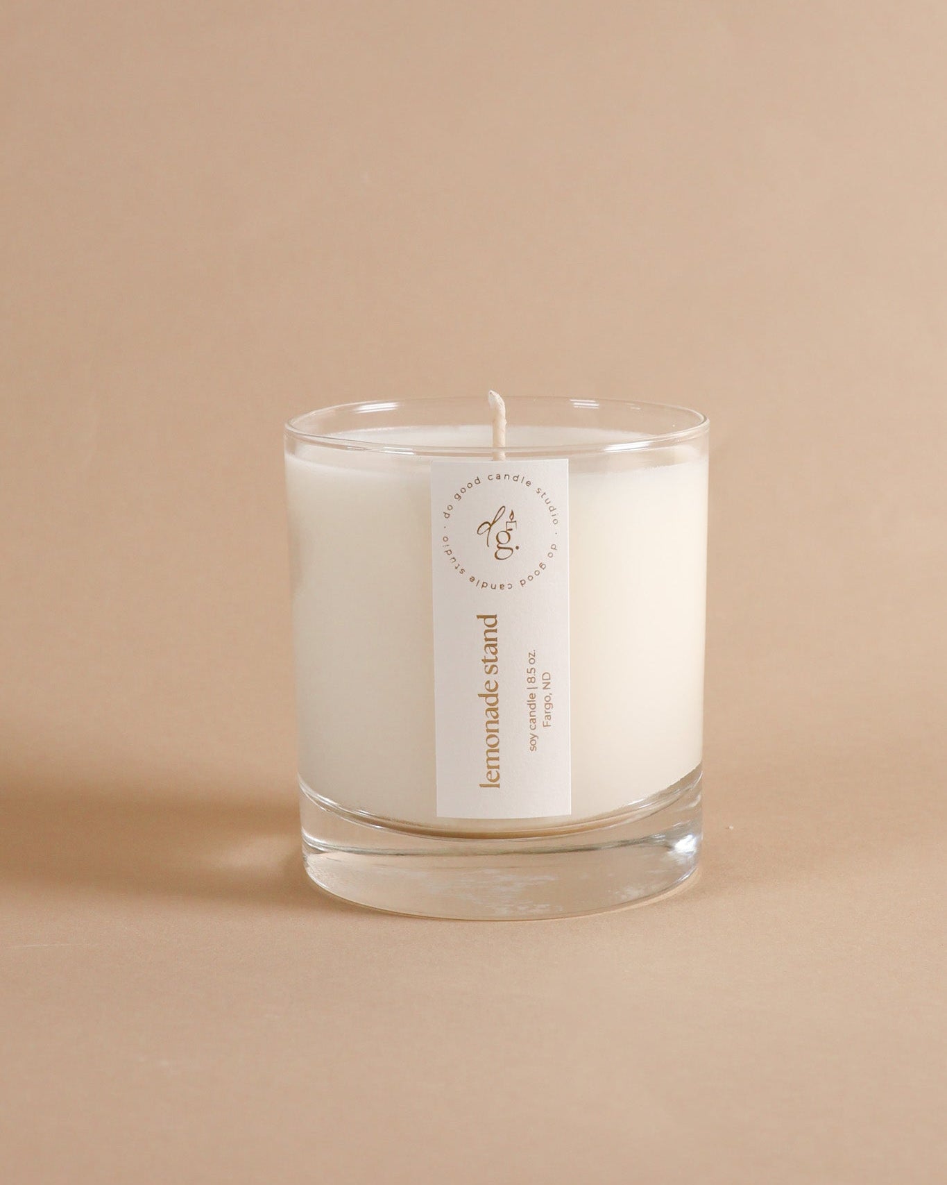 Lemonade Stand 8.5 ounce candle on beige background