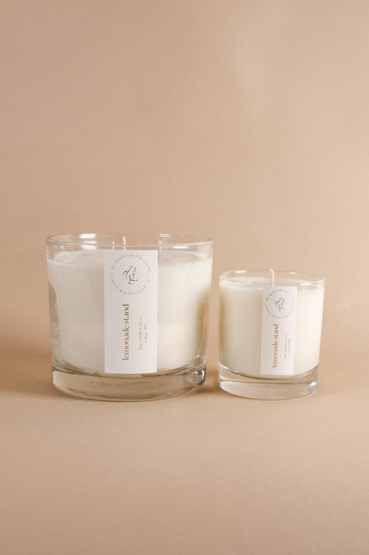 Lemonade Stand triple wick and 8.5 ounce candles together on beige background