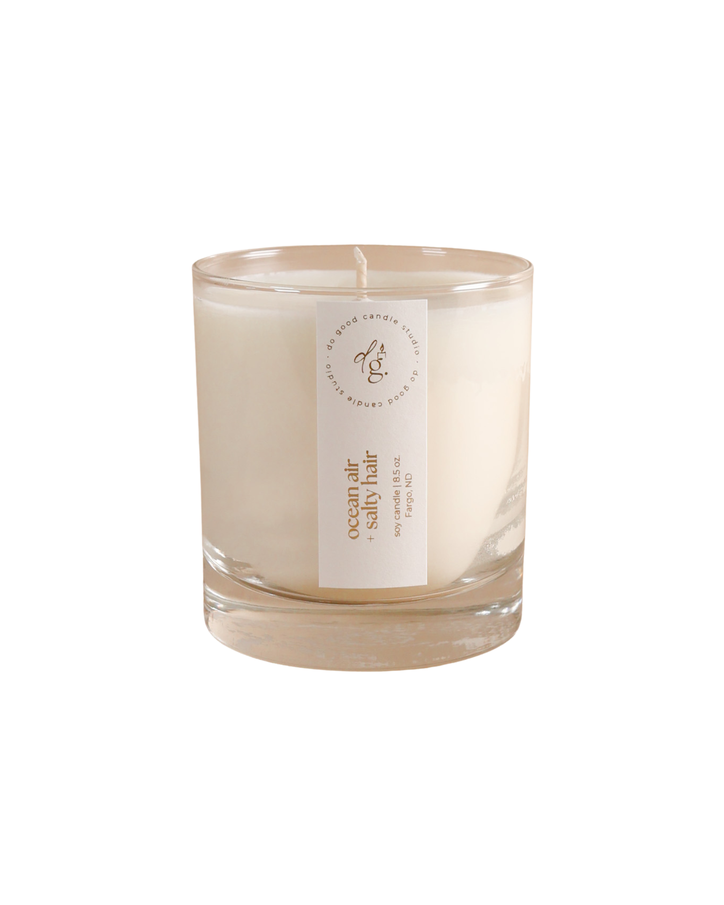 ocean air + salty hair candle on white background