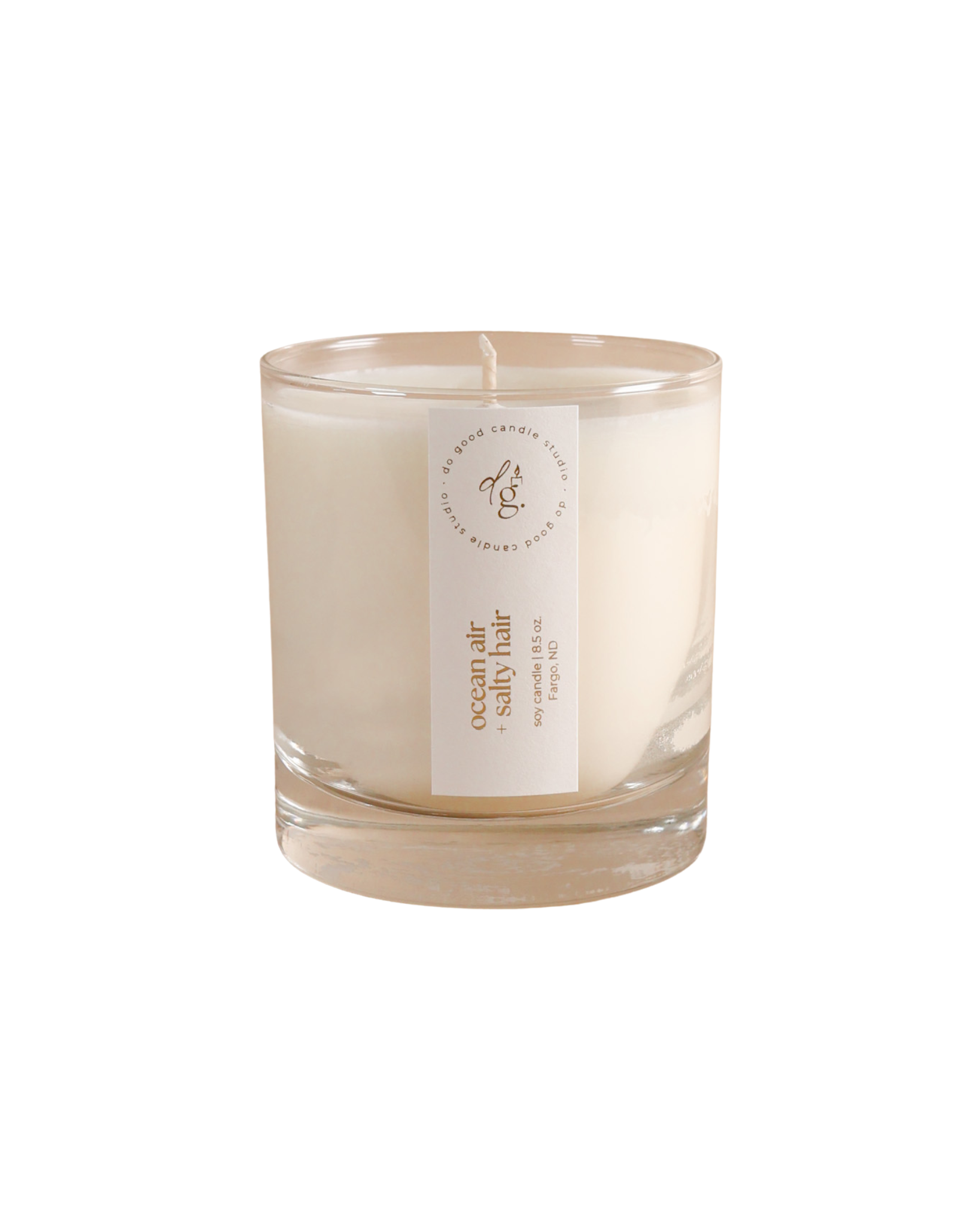 ocean air + salty hair candle on white background