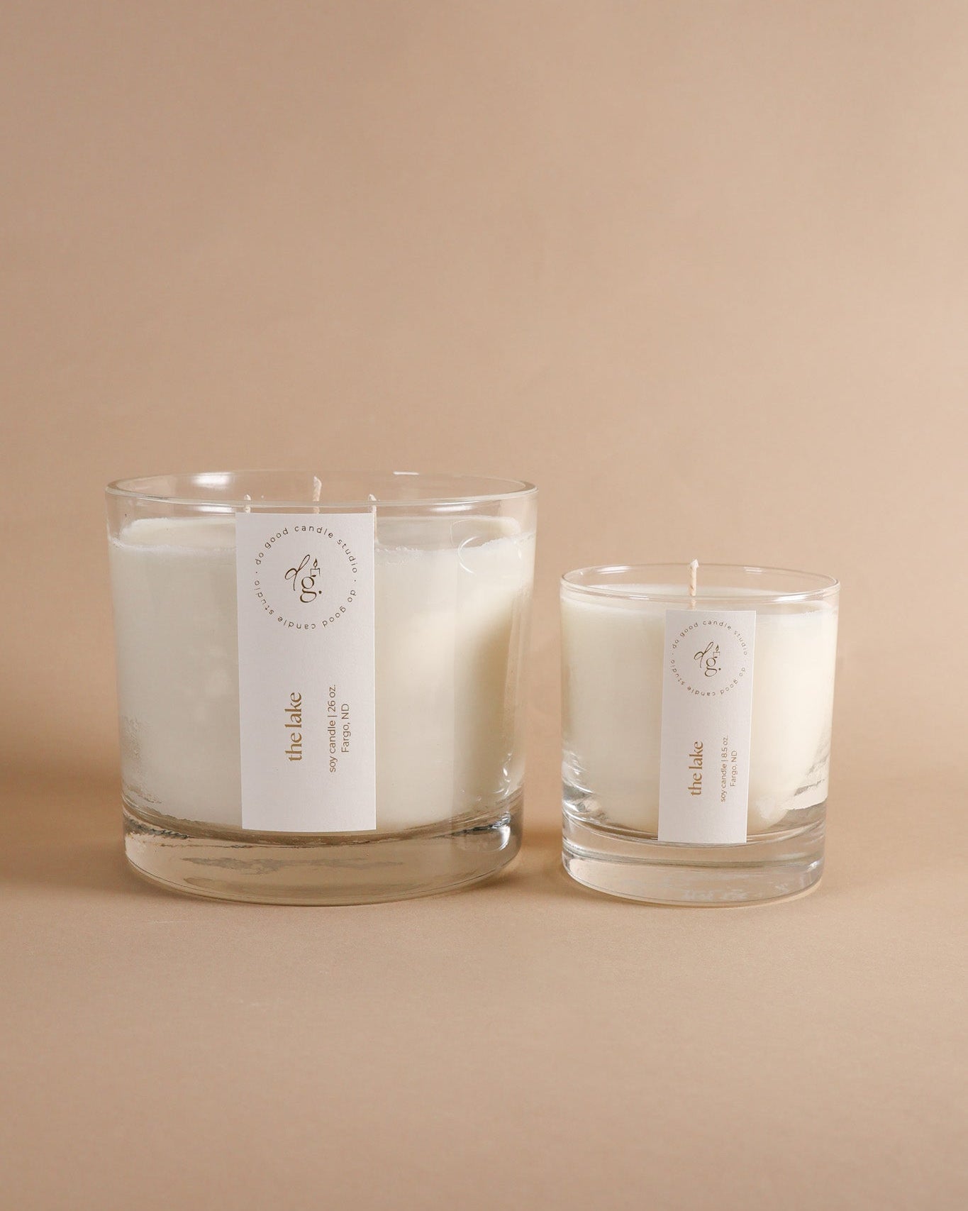 image of triple wick and small the lake candles on beige backdrop